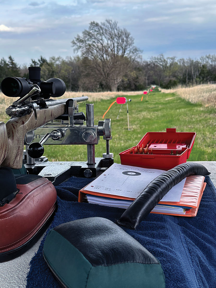 To get a true tune of the rifle, variables need to be controlled. A Seb NEO front rest with Edgewood Gator rear bag on top of a concrete bench secured the rifle. Used throughout the tuning process were double vane wind flags and mirage boards that acted as a gauge for the conditions. This combination assisted in eliminating several human and environmental influences, ensuring accurate and repeatable data.